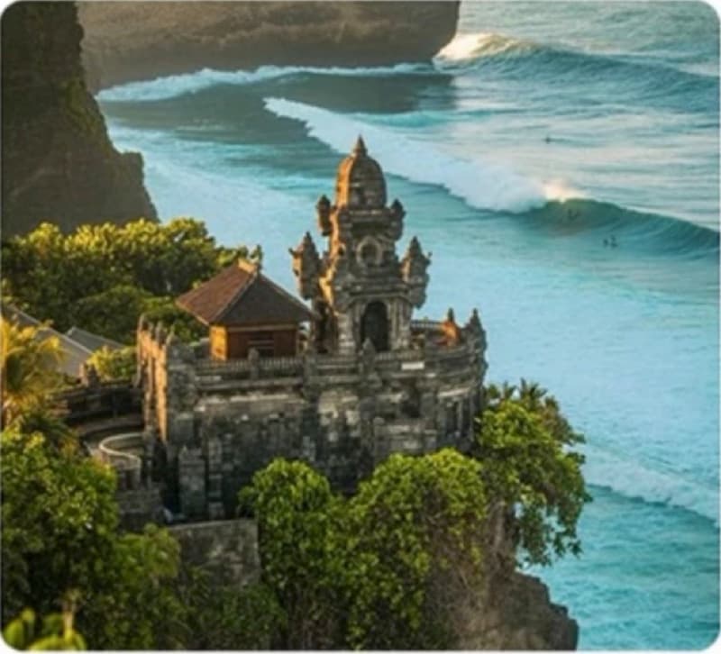A clifftop temple above a breaking surf line