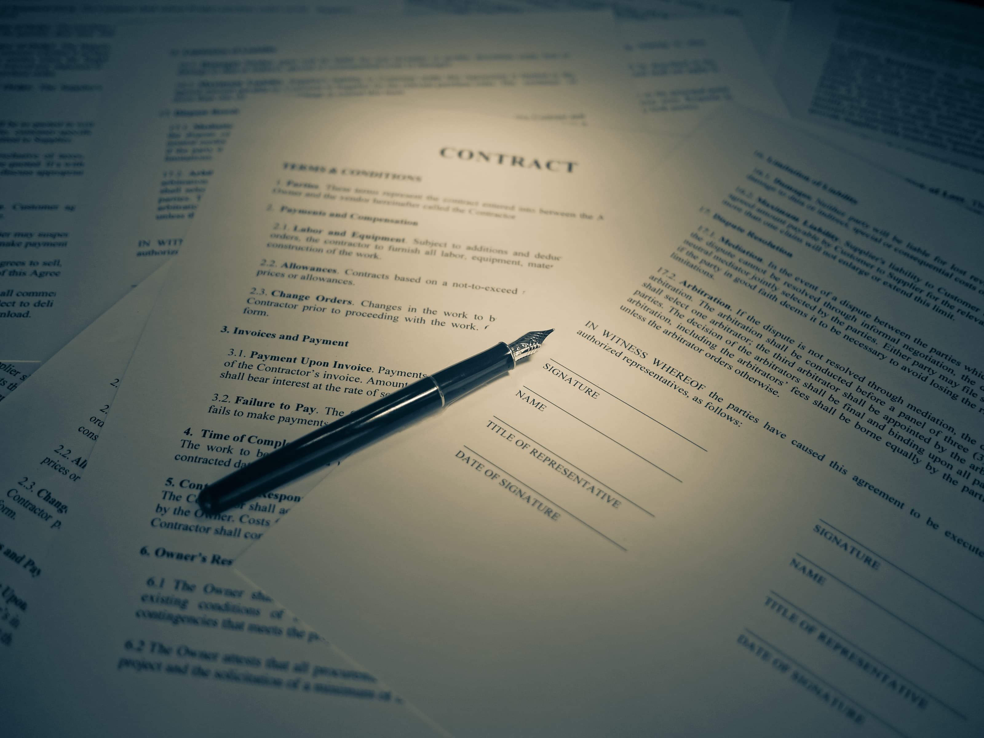 Documents being prepared and signed at a desk